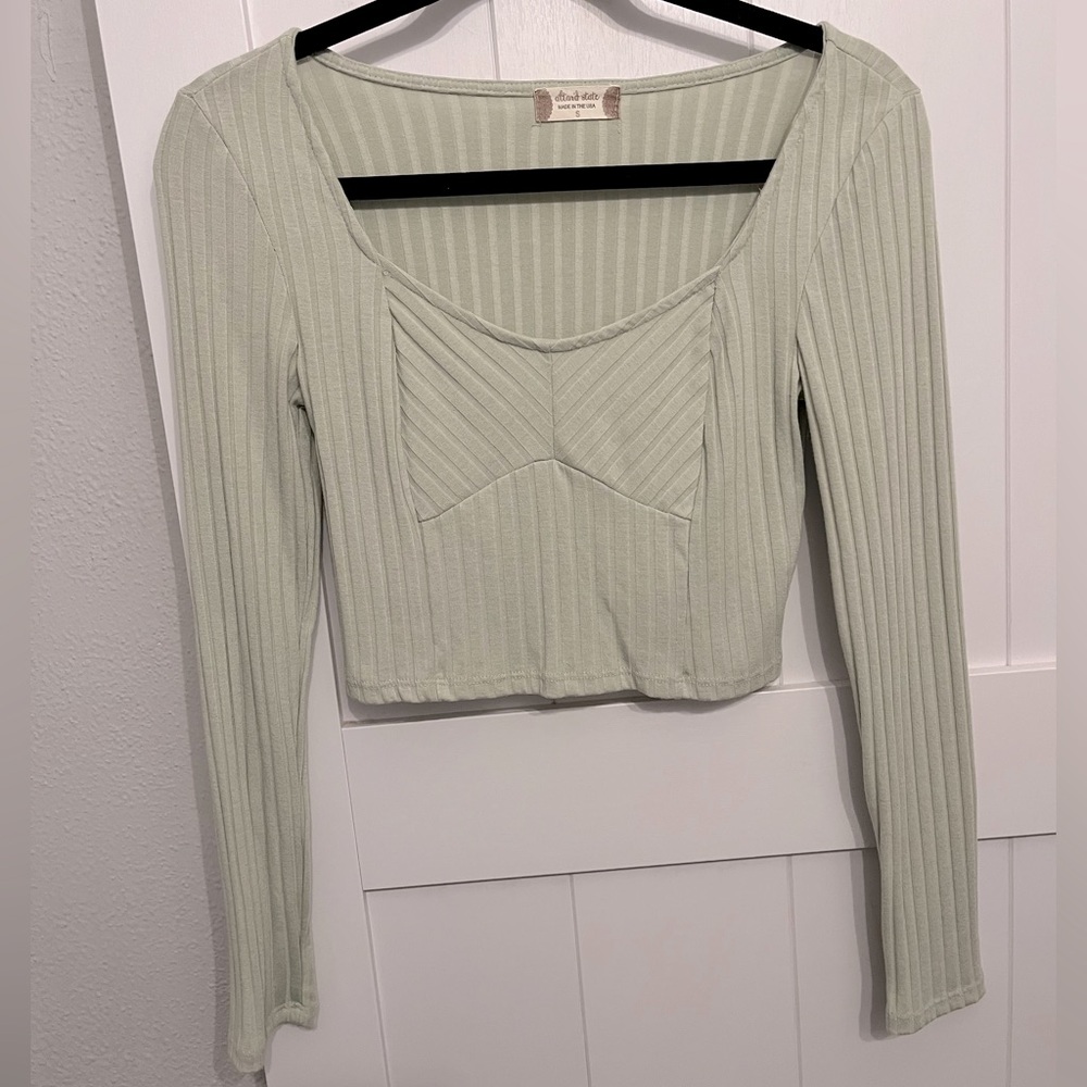 Very light sage green cropped long sleeve top